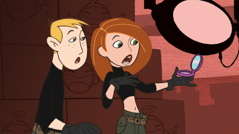 Kim and Ron look at compact in shock